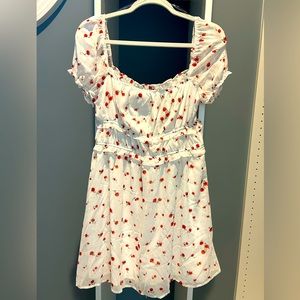 NWT Rixxi dress. White w/red floral pattern. Sz large. Lined. Sheer sleeves.